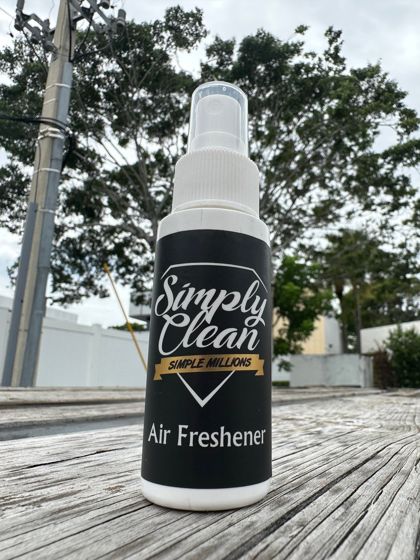 Simple Millions Air Freshener 2 oz White Bottle Image. 